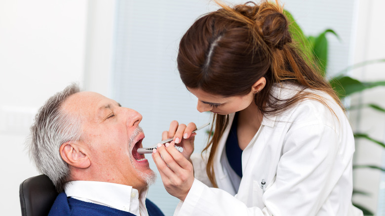 doctor looking inside mouth