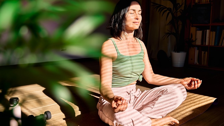 woman meditating in the sunlight