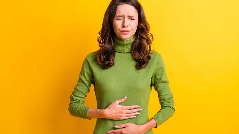 Woman with her hands on her stomach