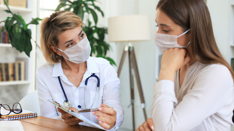 Doctor interviewing and advising patient