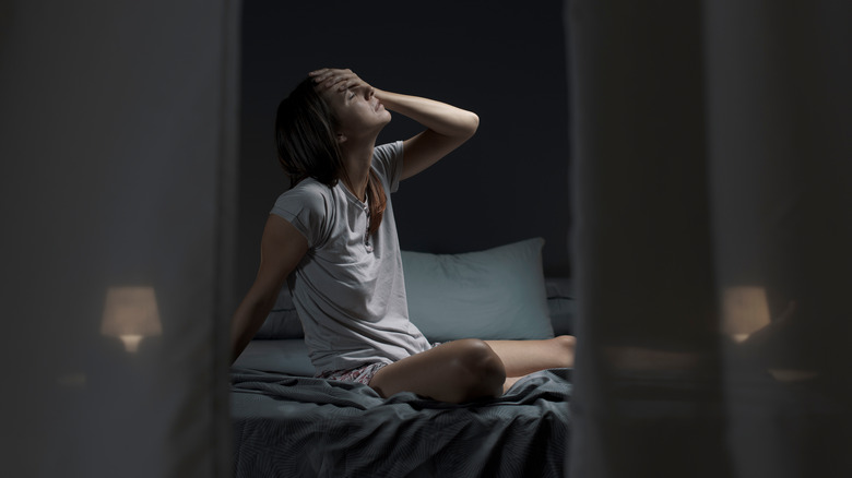 Woman experiencing night sweats