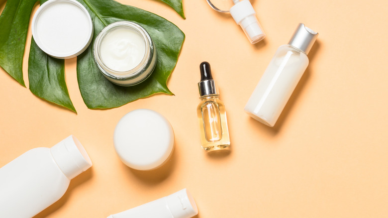 skincare products on peach surface