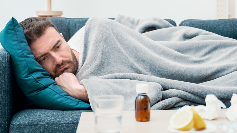 sick man on couch