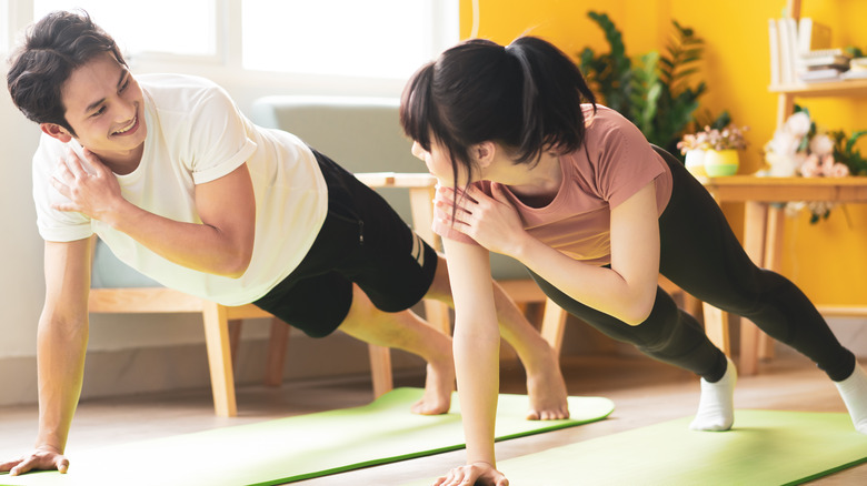 Couple doing calisthenics together