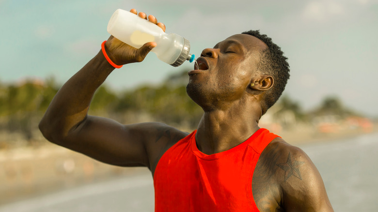 Man drinking water on a hot day