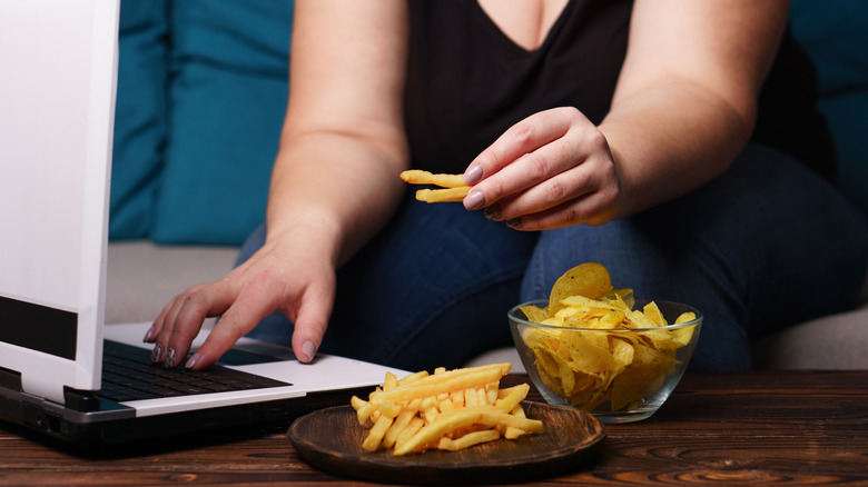 woman sitting and eating 