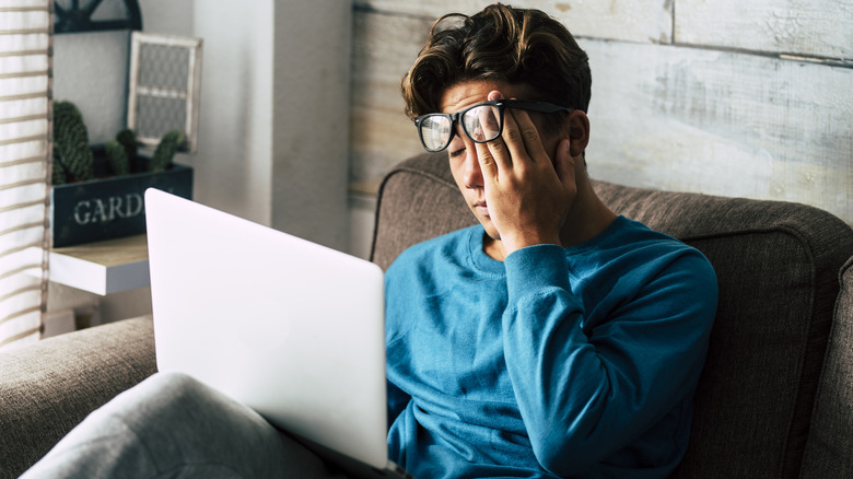 man feeling extremely tired 