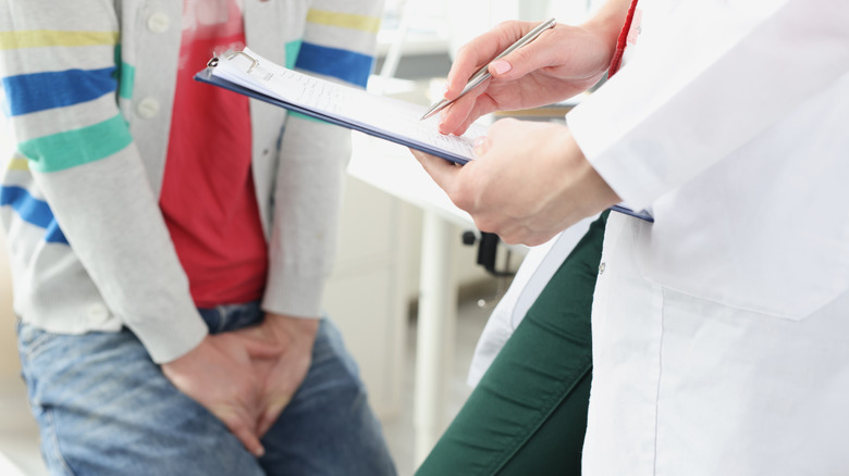 patient talking to doctor about frequent urination