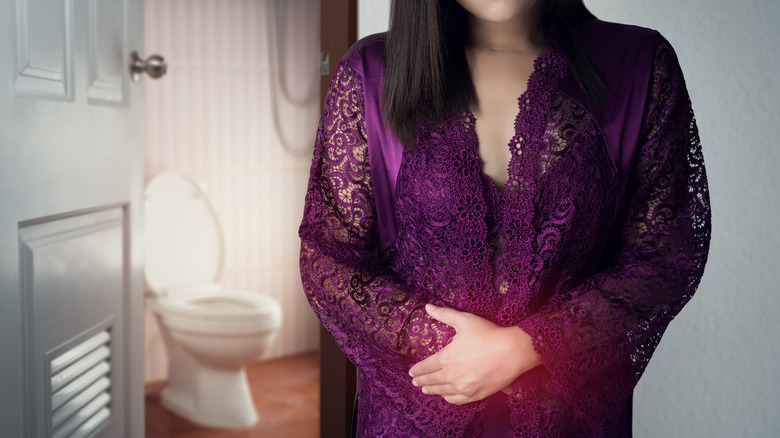 woman returning from nighttime trip to bathroom