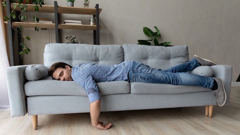 man napping on couch
