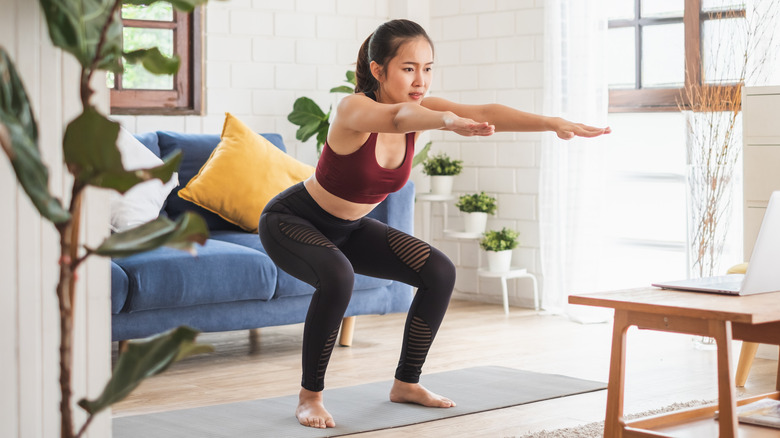 woman doing yoga at home