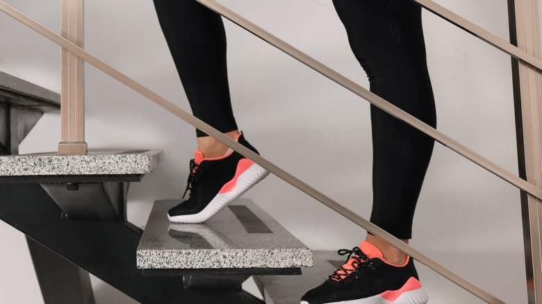 woman wearing workout clothes on stairs