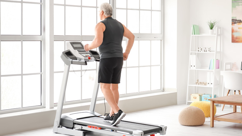 older man working out on treadmill 