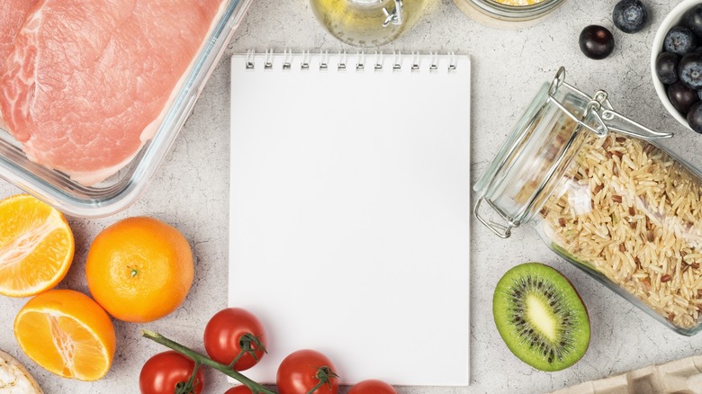 Healthy foods and a notepad