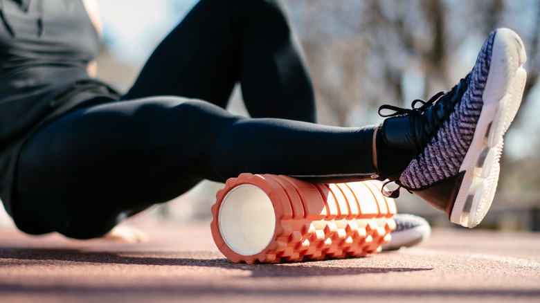 athlete using foam roller