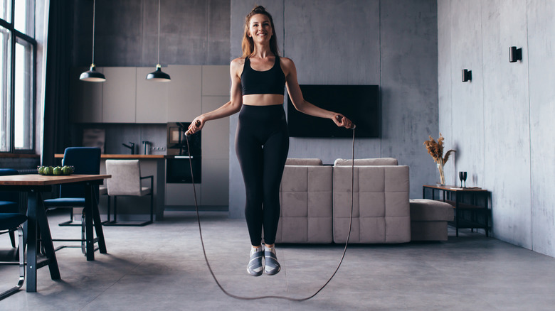woman jumping rope at home