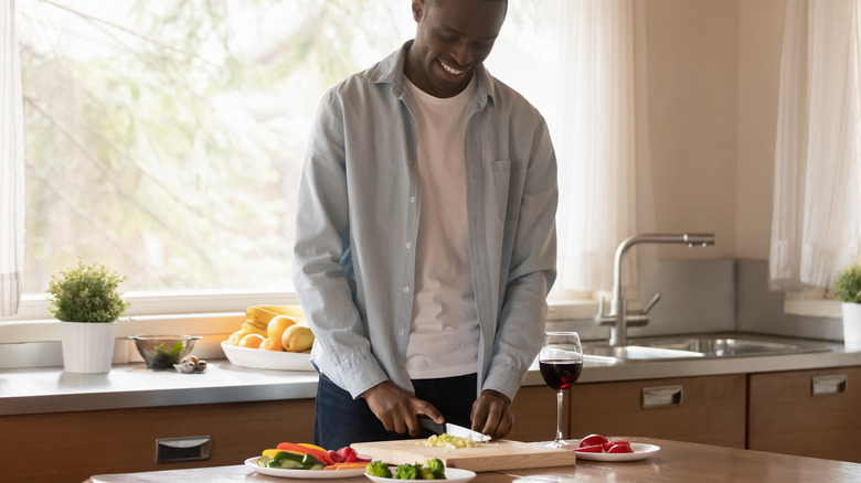 Man chopping veggies