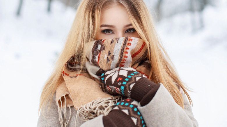 Woman fashionably bundled up for the snow.