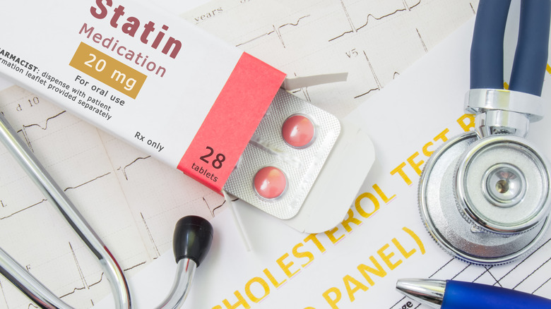 statin medication pack and stethoscope
