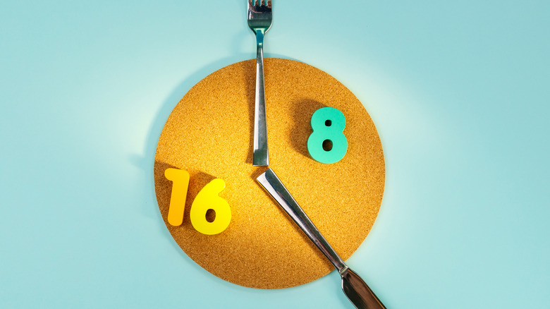 carboard clock with knife fork hands