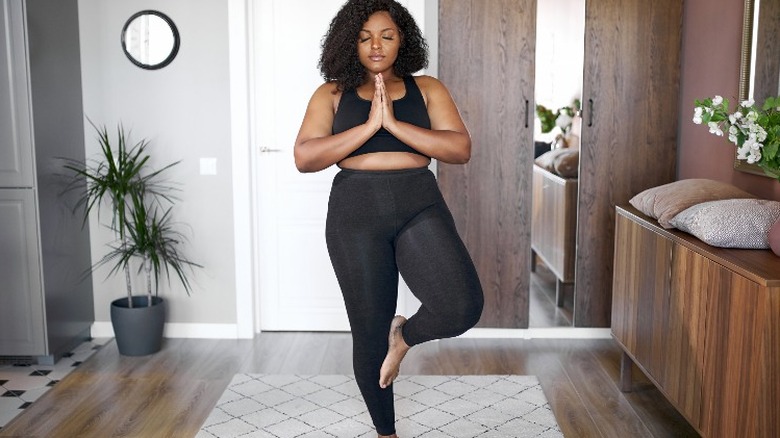 Woman practicing yoga and meditating