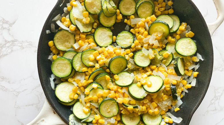 veggies sautéing in pan