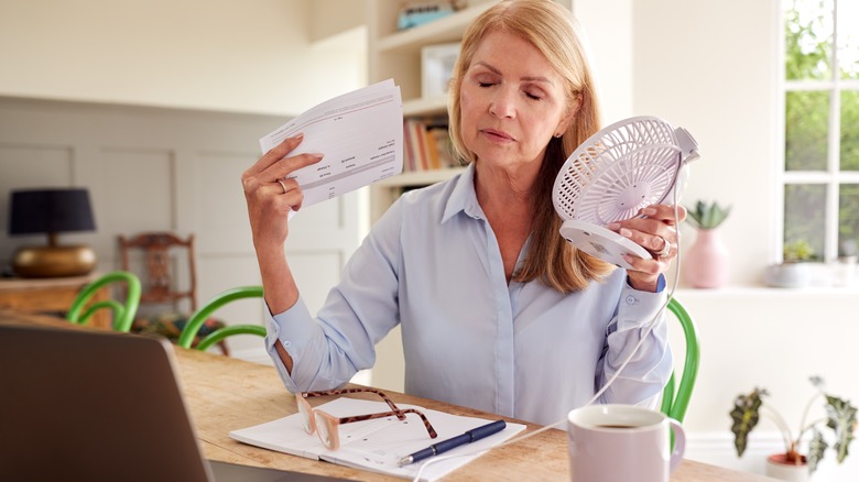 woman fanning herself