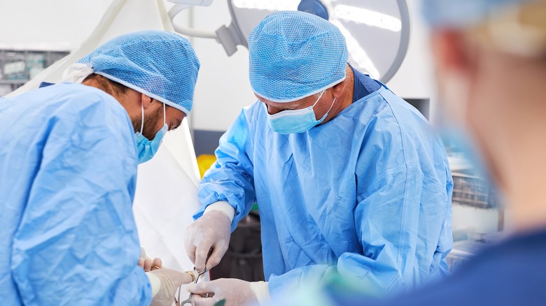 Surgeons performing a surgery