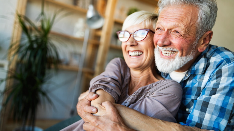 Elderly couple embracing