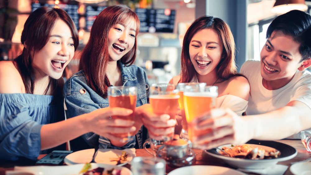 A group of friends dining at a restaurant