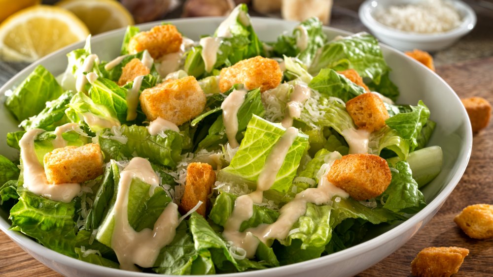 A bowl of salad with dressing