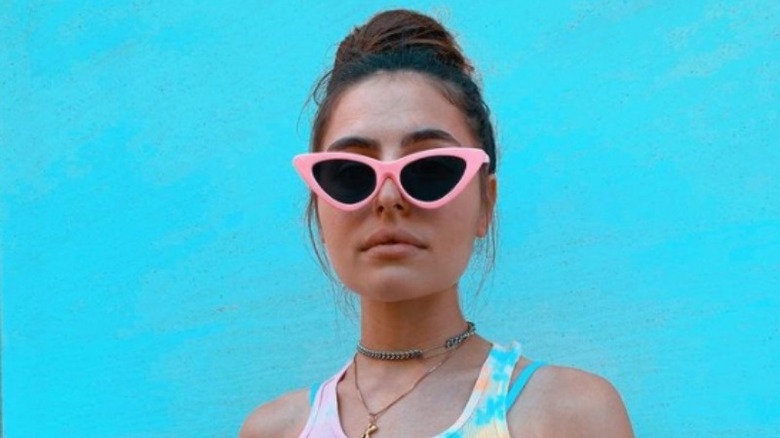 Kitty Terzo wearing pink sunglasses