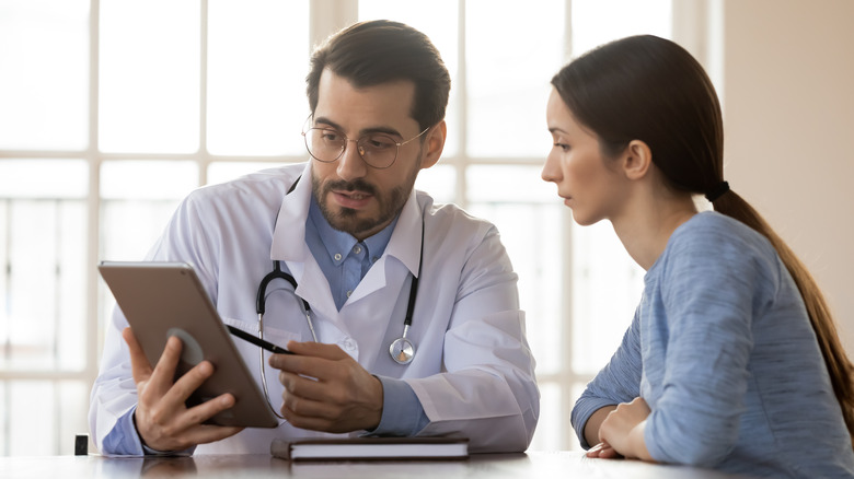 male doctor explaining test results to patient