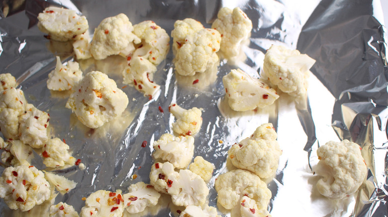 seasoned cauliflower on baking sheet