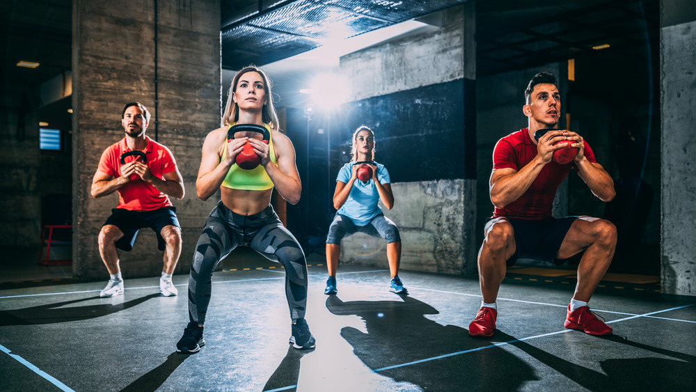 Group doing kettlebell exercises