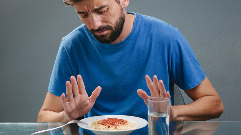 Man refuses a bowl of spaghetti