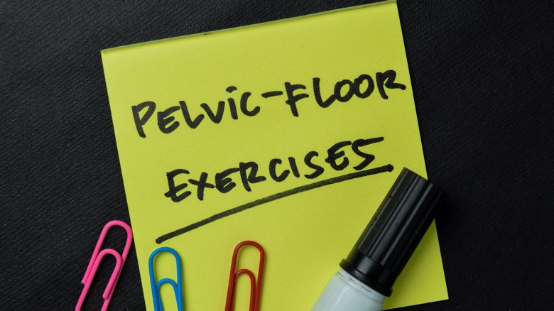 "Pelvic floor exercises" written on sticky note against black background 