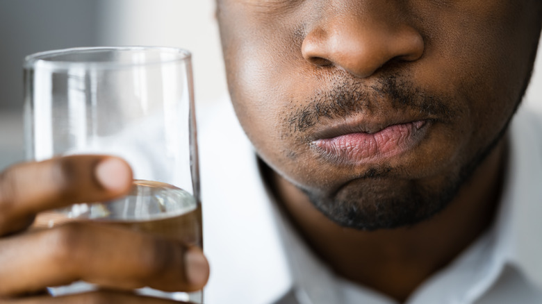 Man with water in his mouth