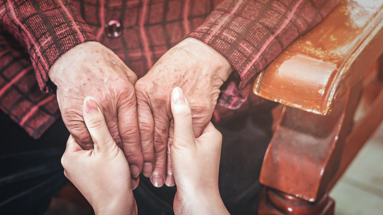 Elderly person's hands showing mottled skin tone