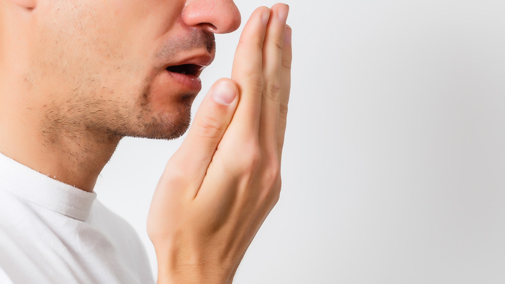 man checking breath