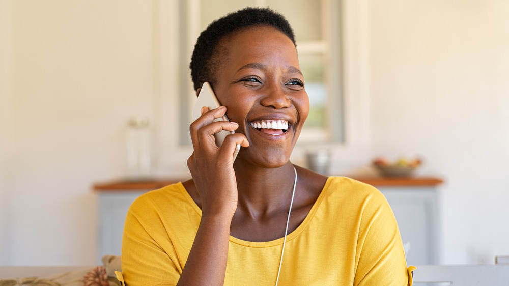 woman laughing on phone