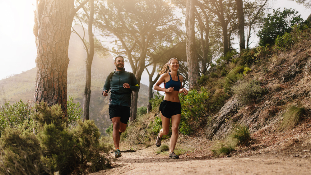 two people running trails