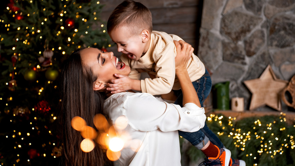 Mother and son in front of Christmas tree