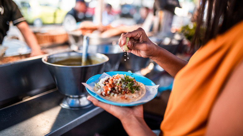 Person eating a lentil taco