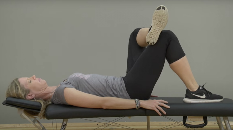 woman doing figure-four stretch