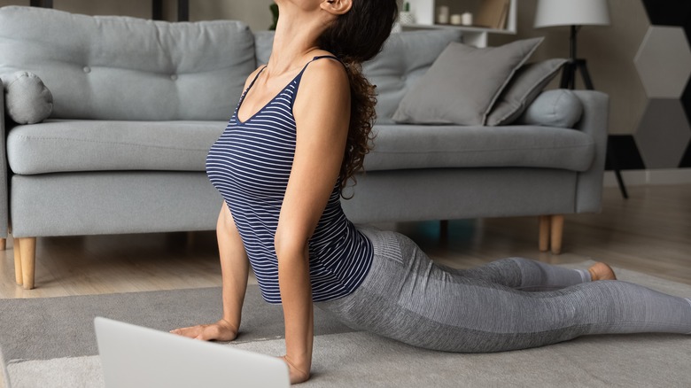 woman doing cobra pose