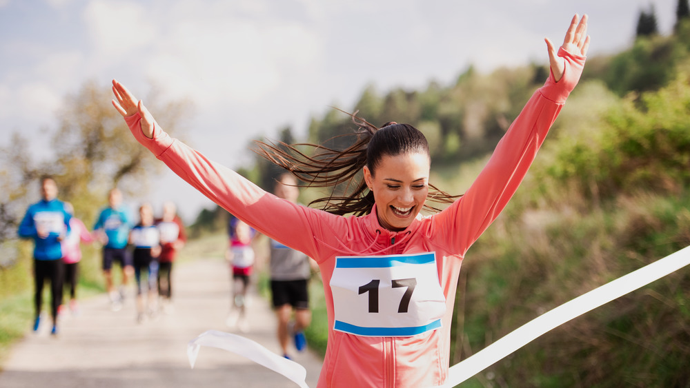 woman crossing a finish line