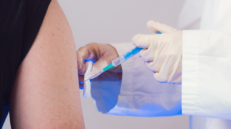 woman getting covid vaccine