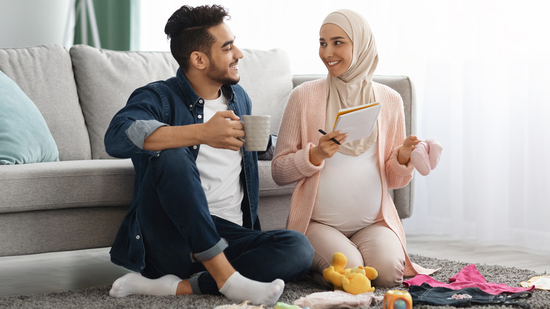 Smiling father and pregnant mother