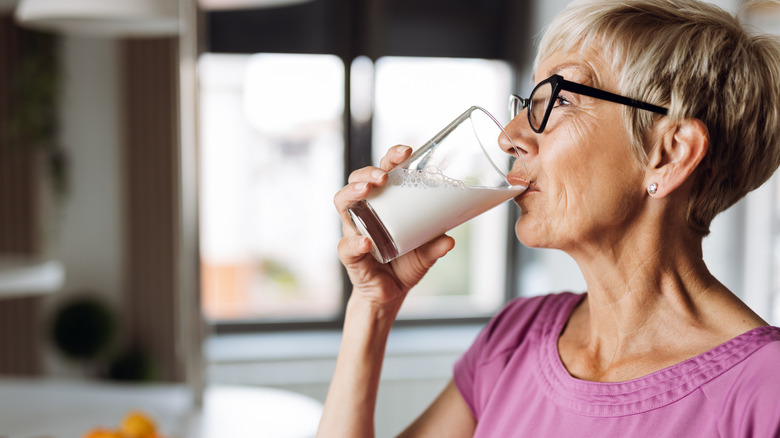 Woman drinking glass of milk